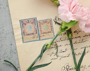 A Hand-Written Letter with Stamps from Denmark and a Rose 